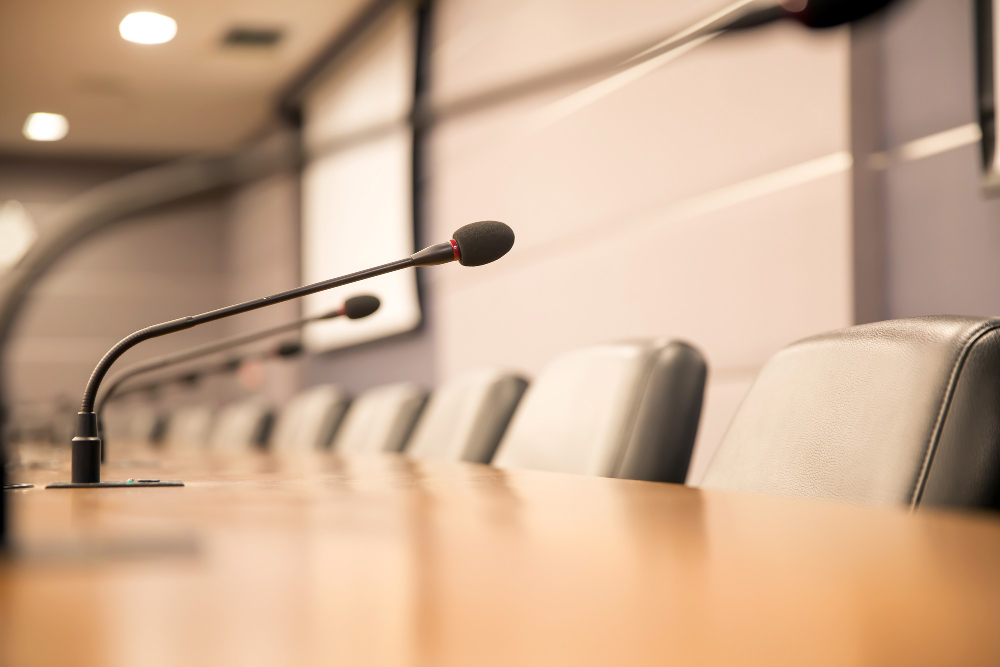 close-up-conference-microphone-meeting-table